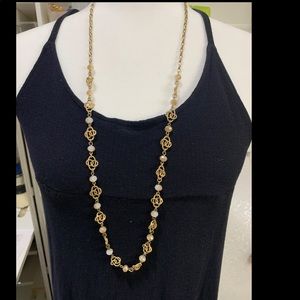 Long chain necklace with adjustable length.